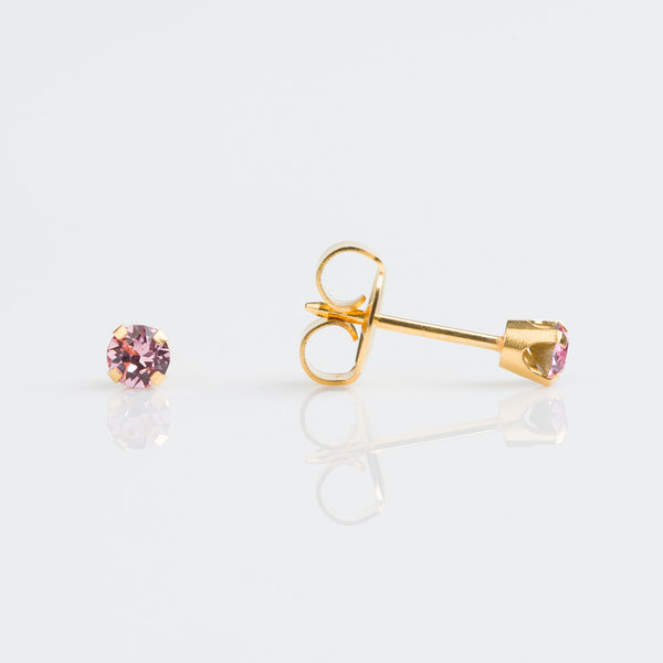 9ct gold with 3mm tiffany set clear, pink or aqua cubic zircon earrings pierced with the Studex System 75 Gun