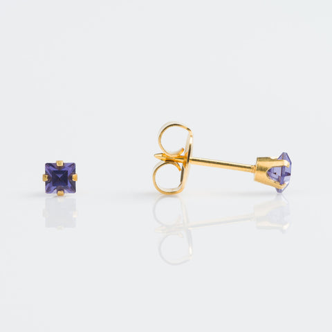 9ct gold earring with princess cut tanzanite pierced with the Studex System 75 Gun