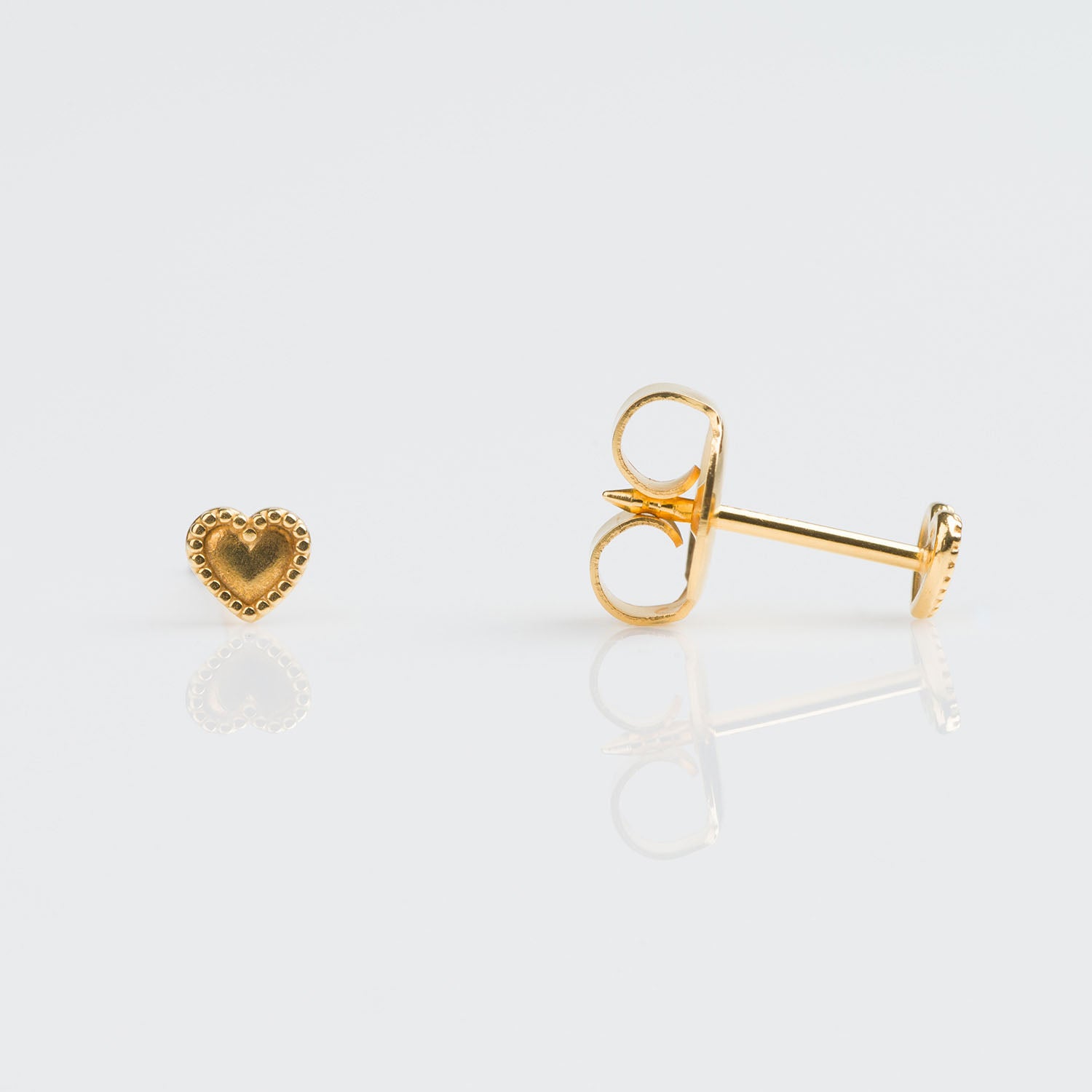 9ct gold beaded heart earrings pierced with the Studex System 75 Gun