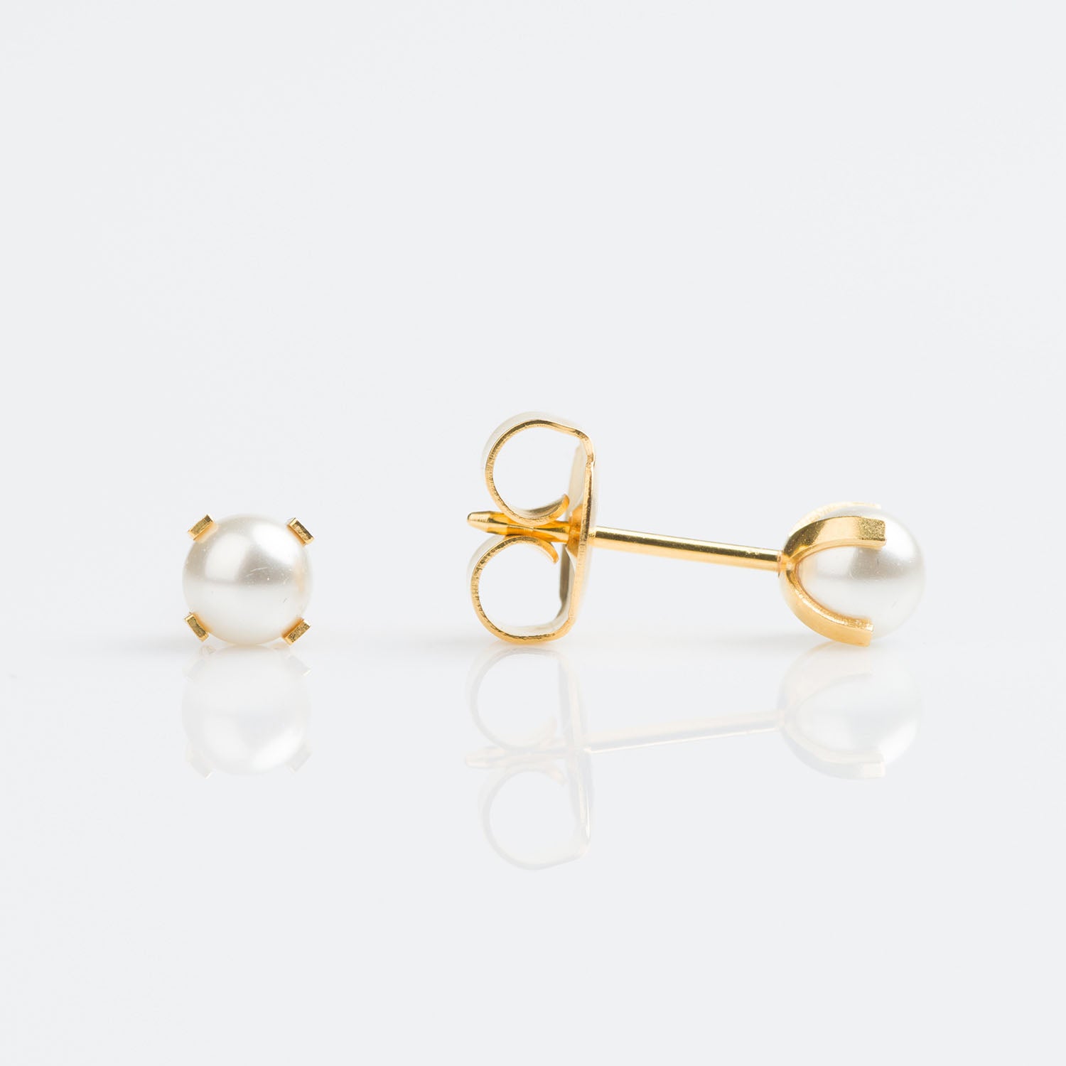 9ct gold with 4mm tiffany set synthetic pearl earrings pierced with the Studex System 75 Gun